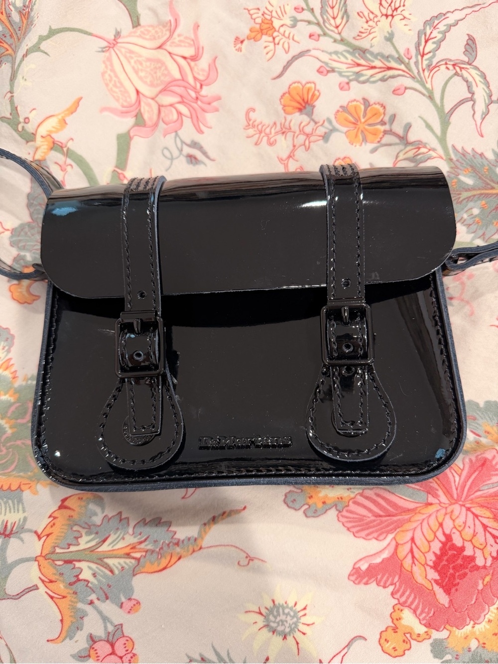 Dr. Marten 7 inch mini patent leather crossbody bag.
